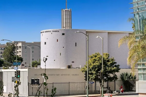 a living room with furniture and large window