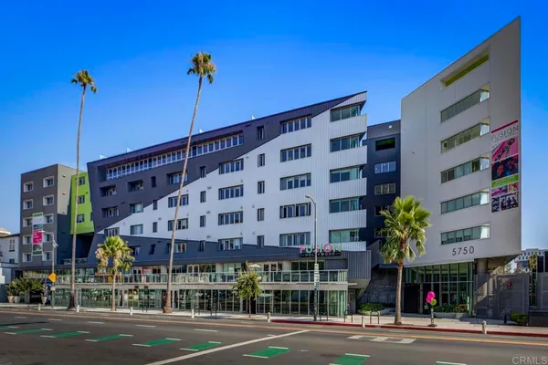 a outdoor space with patio the couches and a potted plant on the table