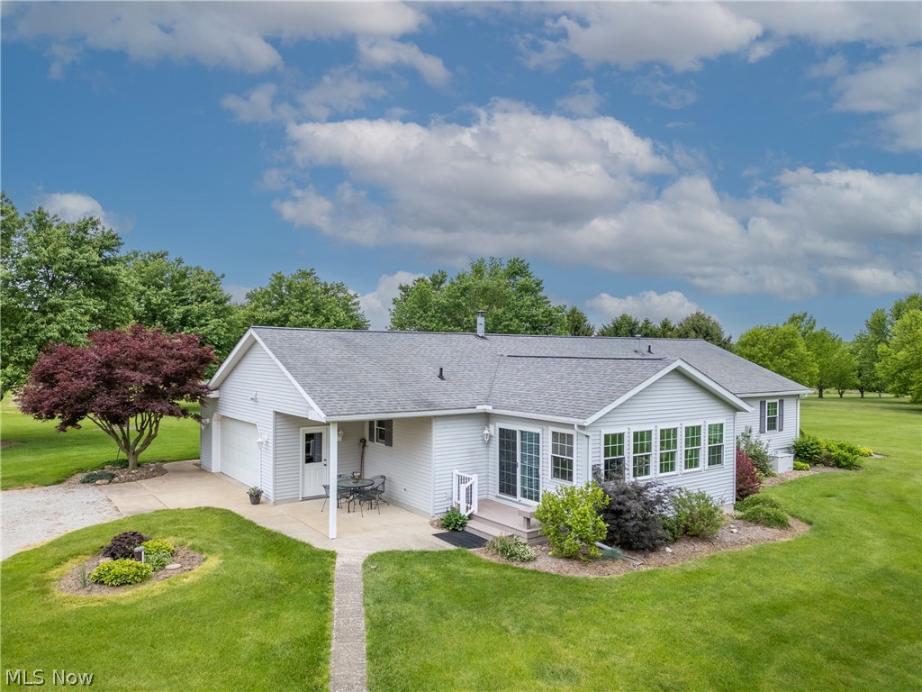 6341 Burbank Road Wooster, OH 44691 - Photo 2 of 36 Back of property with a garage and a yard