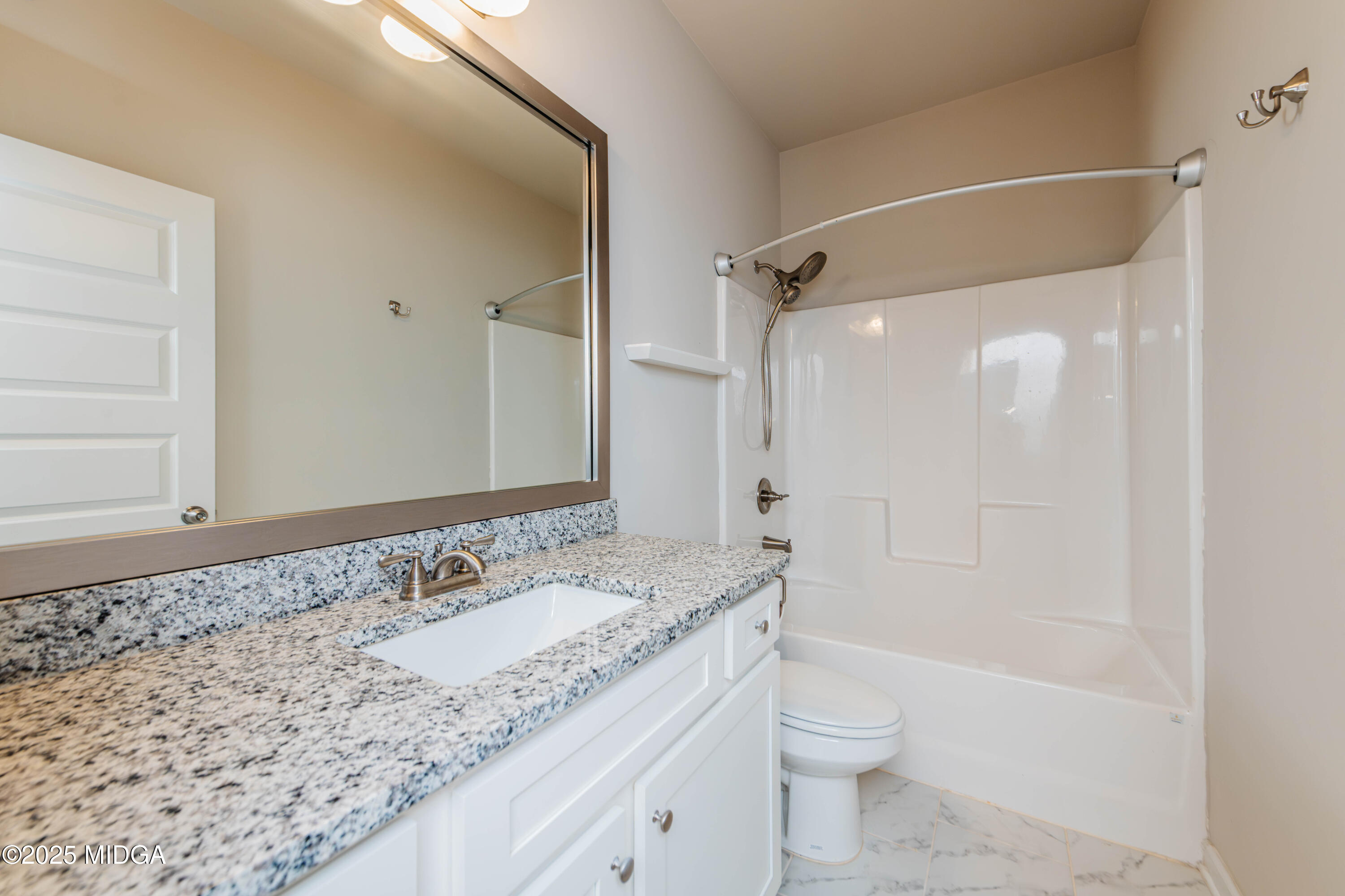 116 Red Birch Lane Warner Robins, GA 31093 - Photo 11 of 34 a bathroom with a granite countertop sink toilet and shower
