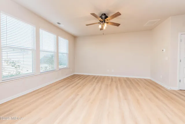 a view of an empty room and window