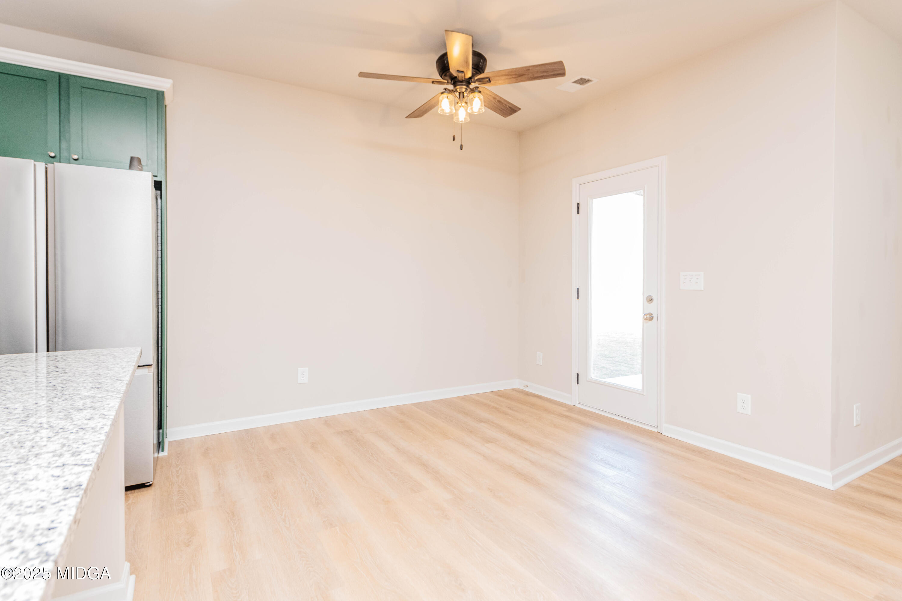 116 Red Birch Lane Warner Robins, GA 31093 - Photo 20 of 34 an empty room with a fan and a ceiling fan