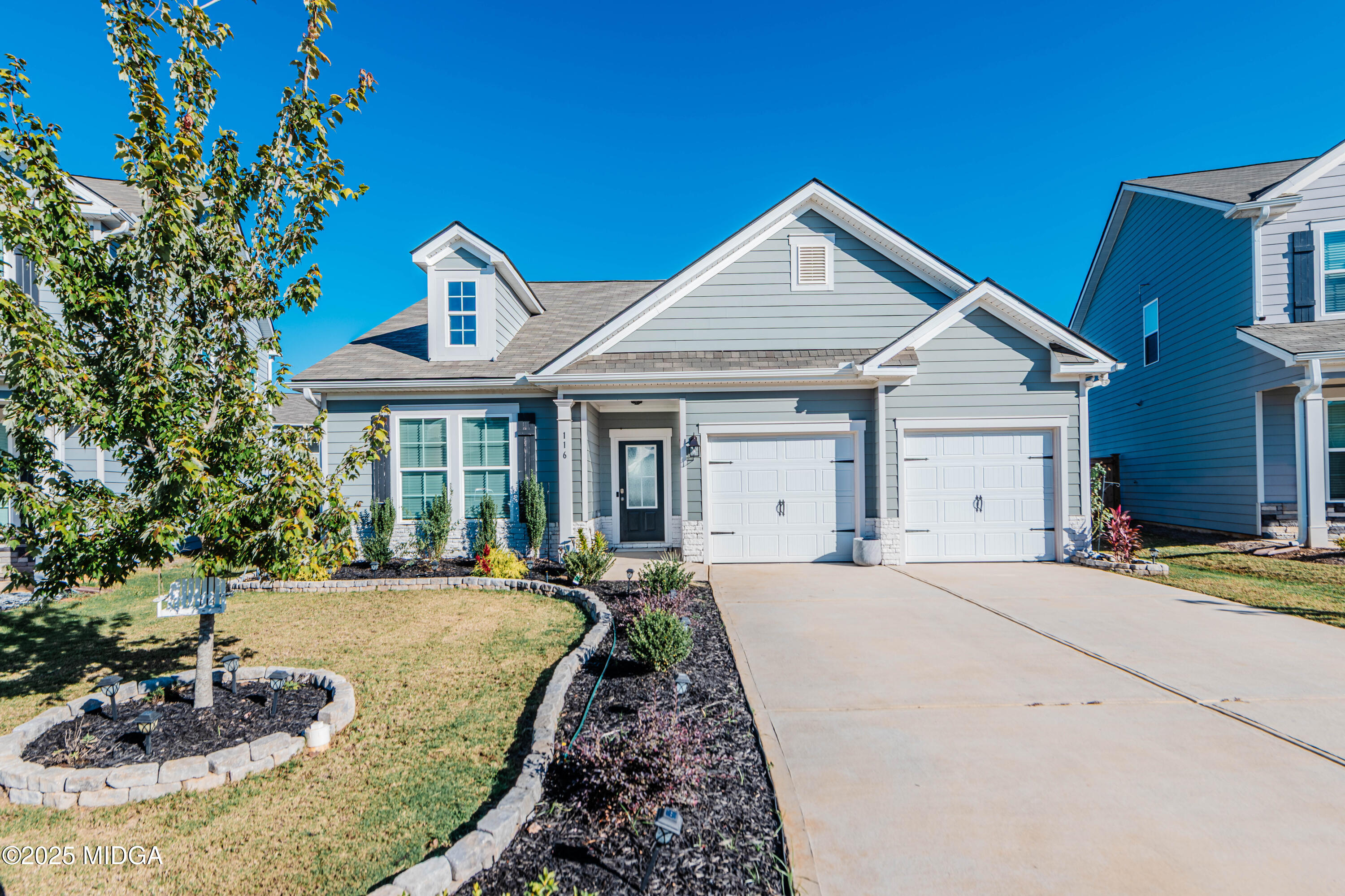 116 Red Birch Lane Warner Robins, GA 31093 - Photo 2 of 34 a front view of a house with a yard