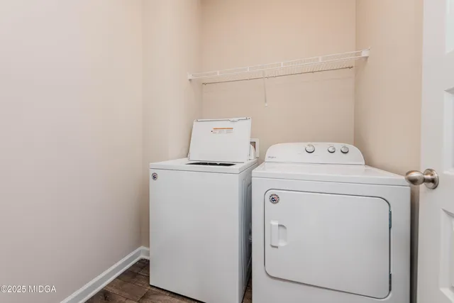 a utility room with dryer and washer