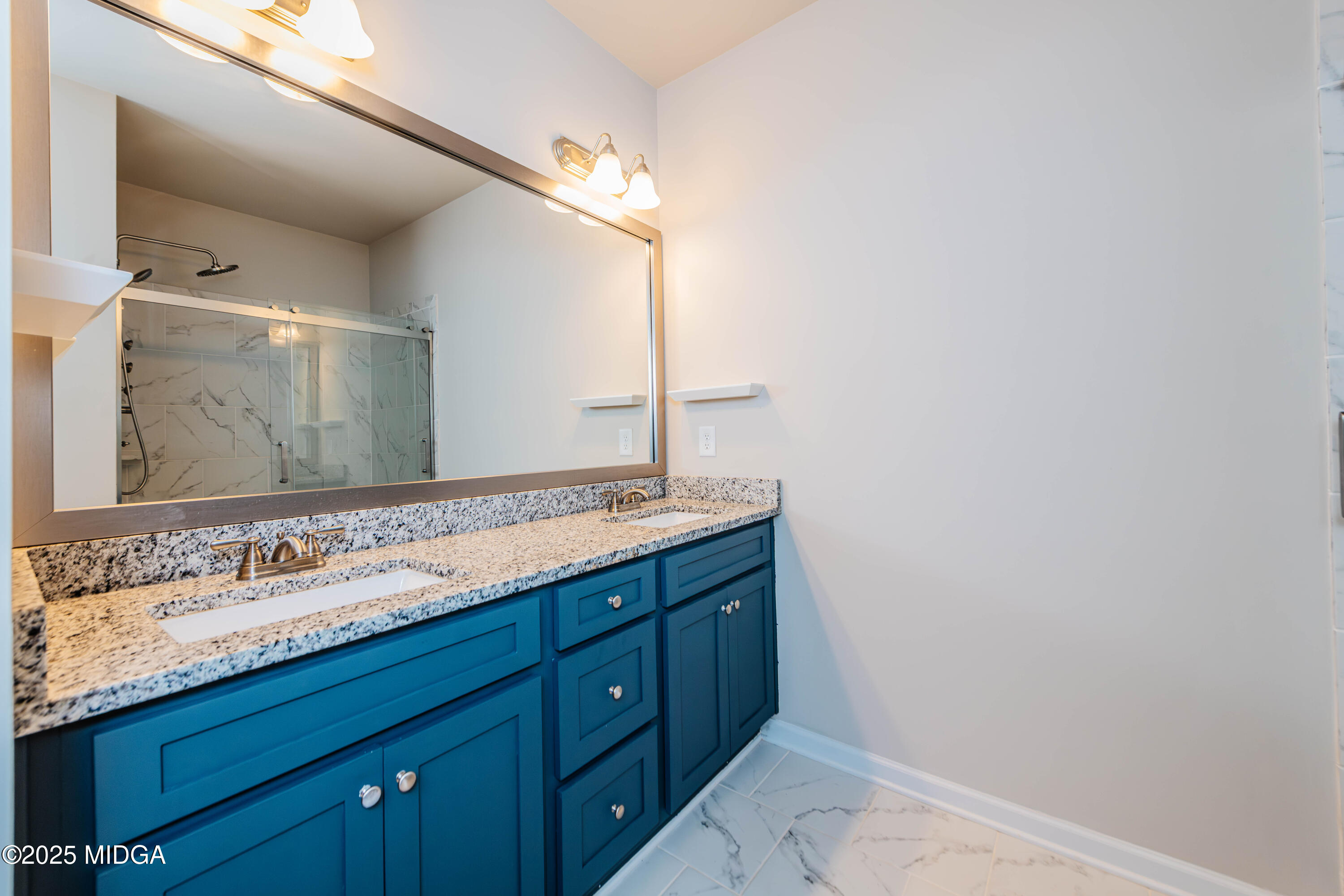 116 Red Birch Lane Warner Robins, GA 31093 - Photo 26 of 34 a bathroom with a granite countertop double vanity sink and a mirror