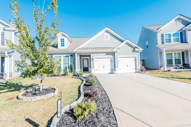 a front view of a house with a yard