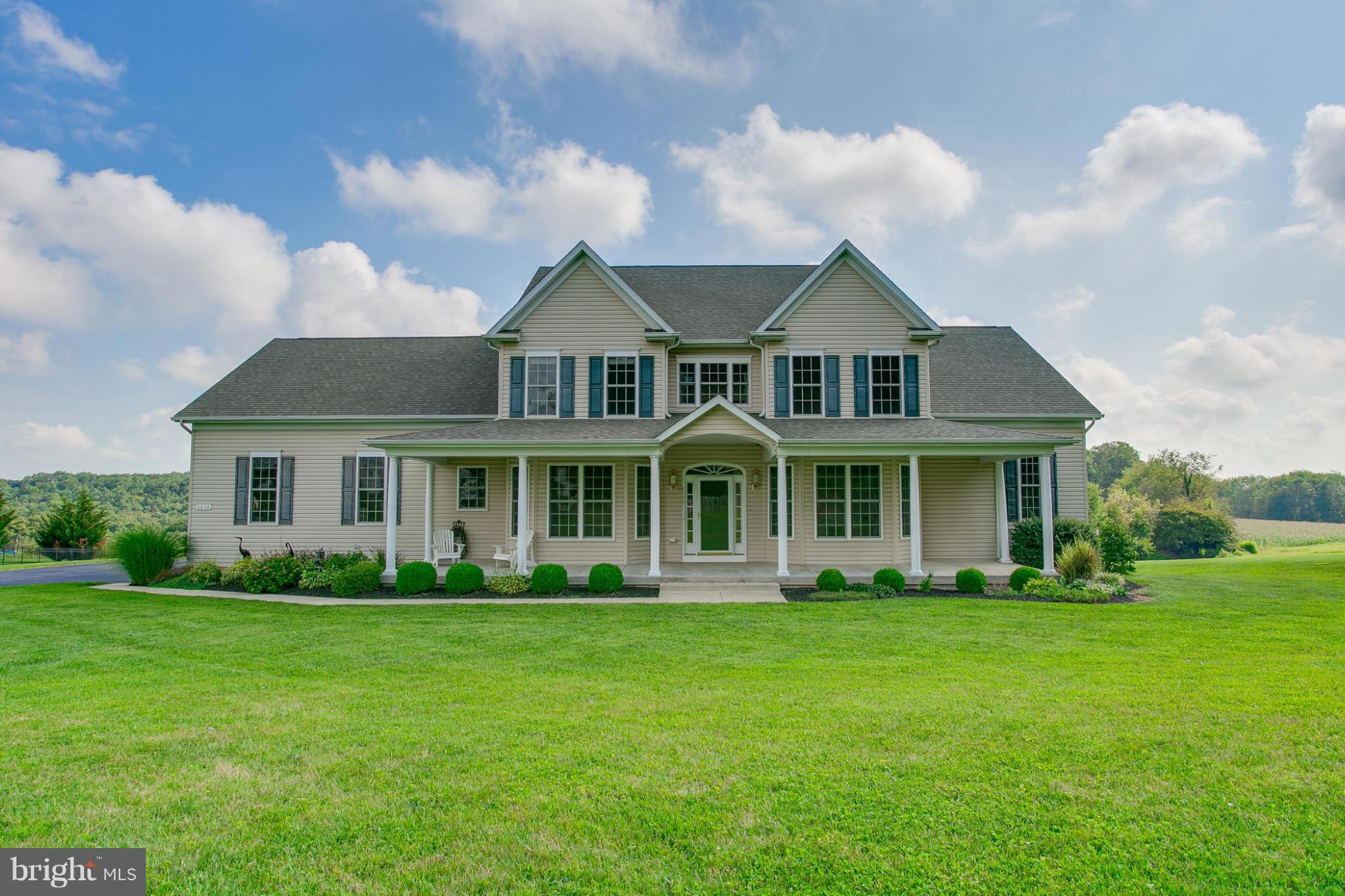 4628 Dave Rill Road Hampstead, MD 21074 - Photo 1 of 30 a front view of a house with a garden