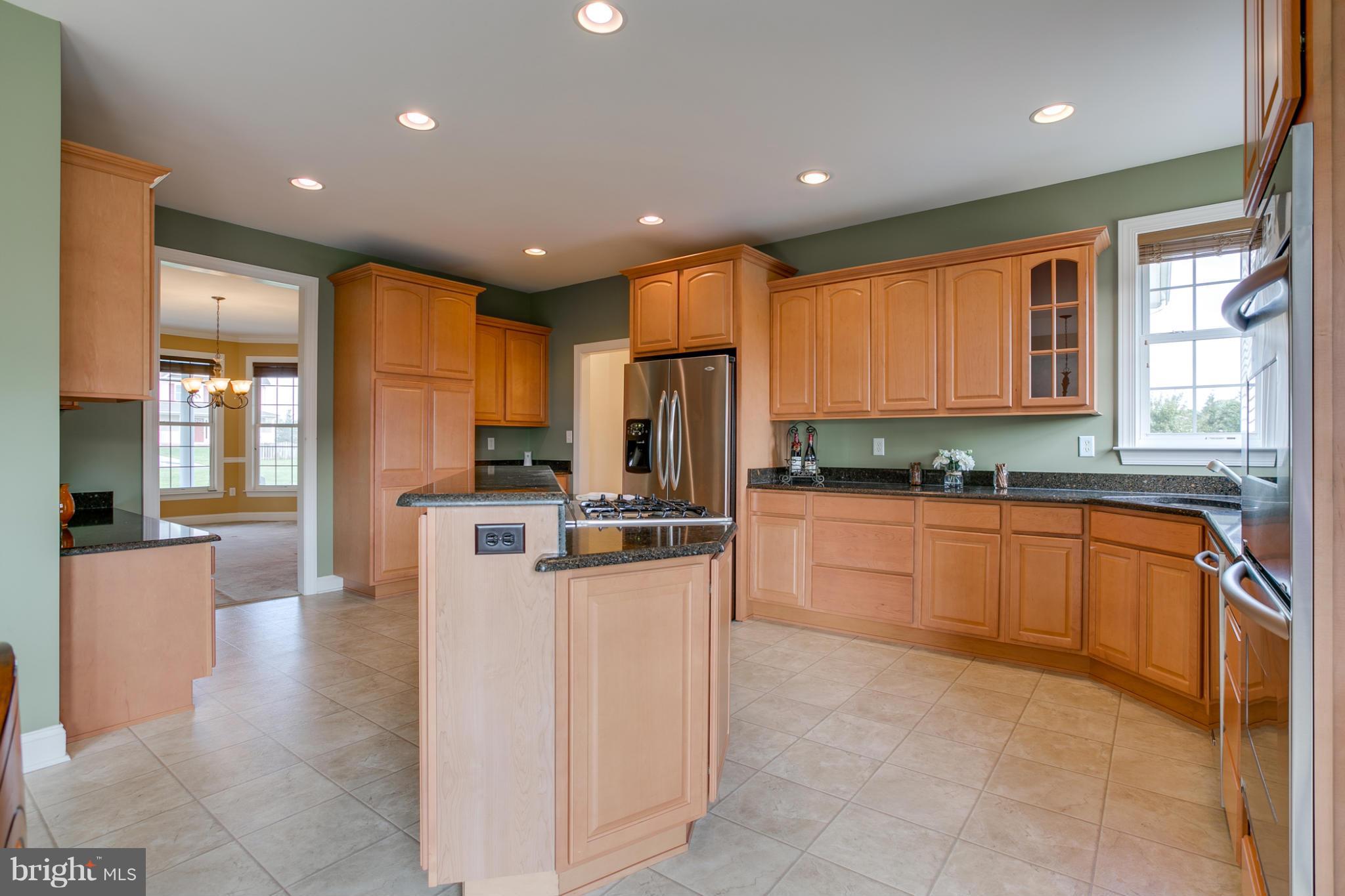 4628 Dave Rill Road Hampstead, MD 21074 - Photo 13 of 30 a large kitchen with stainless steel appliances lots of counter top space cabinets and a window