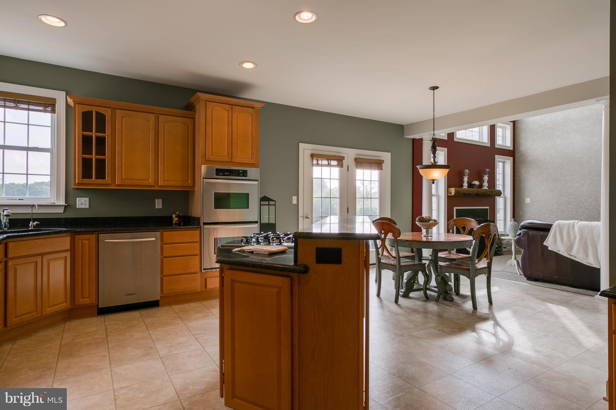 4628 Dave Rill Road Hampstead, MD 21074 - Photo 14 of 30 a kitchen with sink cabinets and dining table