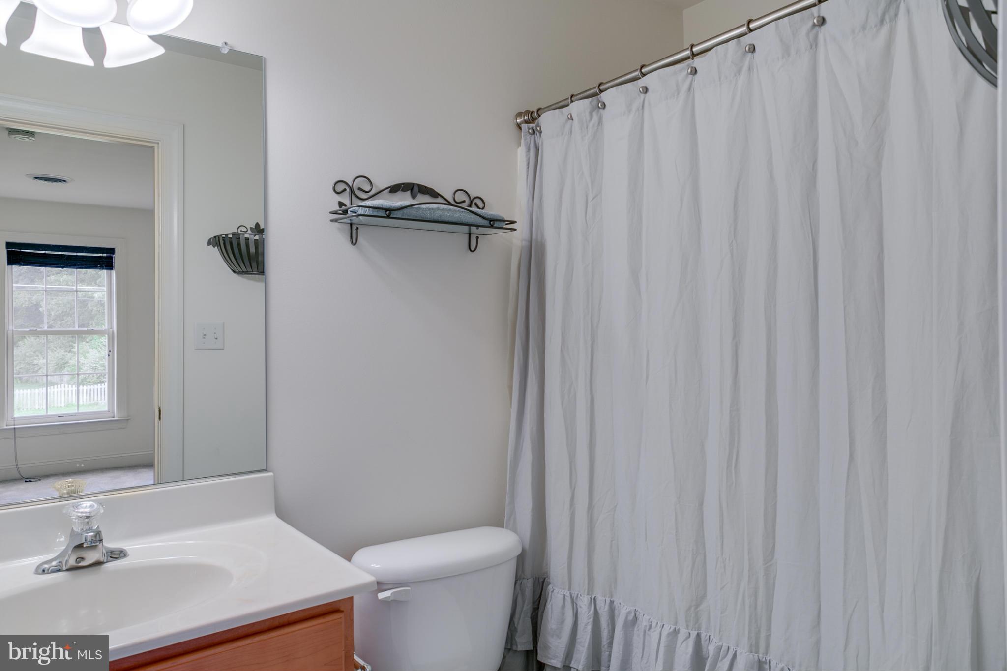 4628 Dave Rill Road Hampstead, MD 21074 - Photo 17 of 30 a bathroom with a sink a toilet and shower