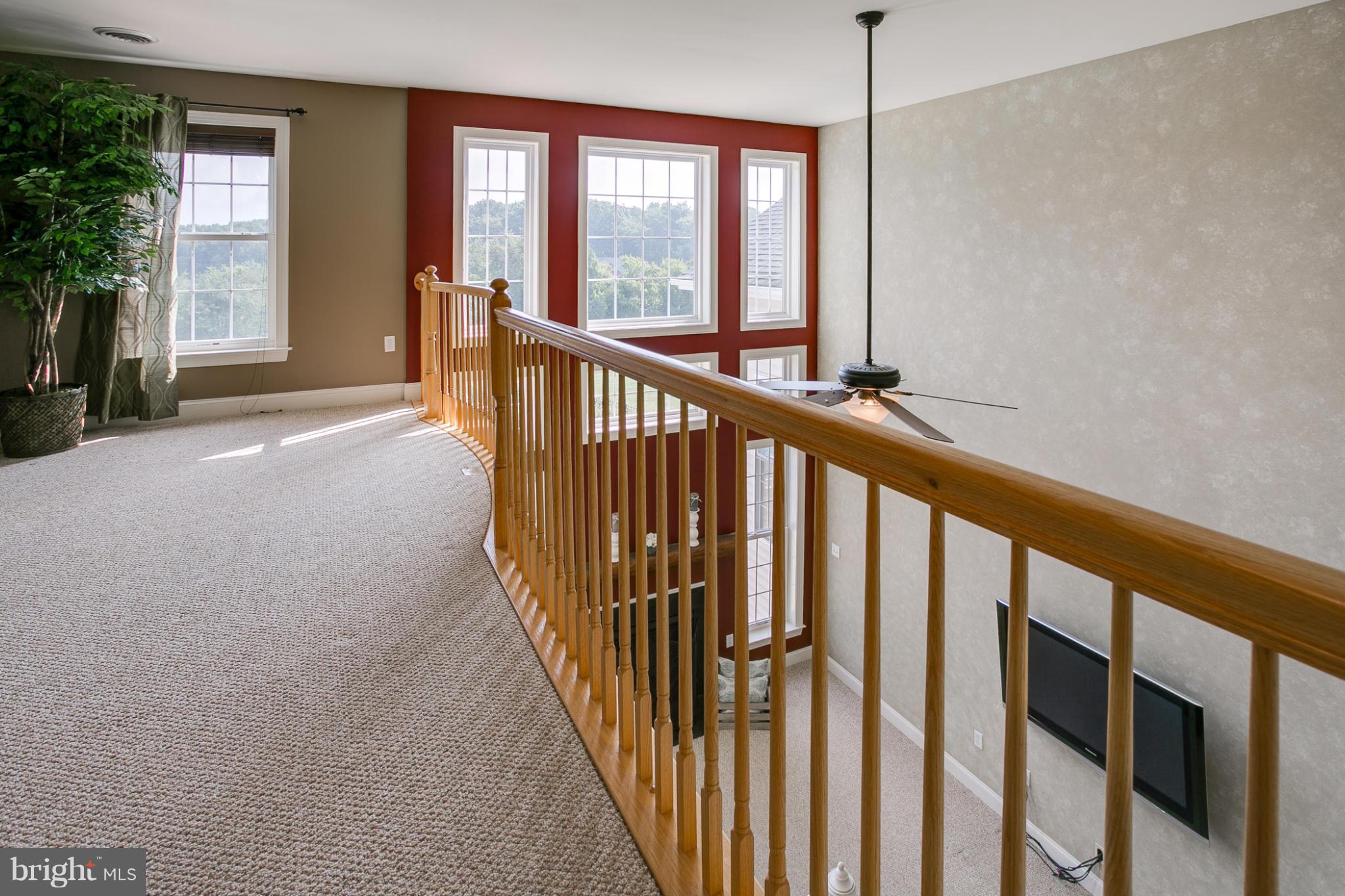 4628 Dave Rill Road Hampstead, MD 21074 - Photo 19 of 30 a view of staircase with windows