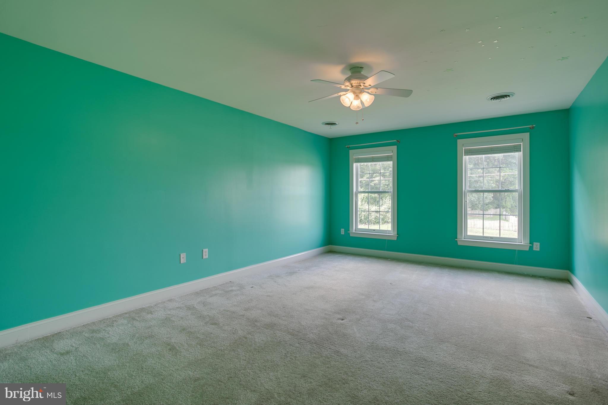 4628 Dave Rill Road Hampstead, MD 21074 - Photo 22 of 30 a view of an empty room with window and chandelier fan