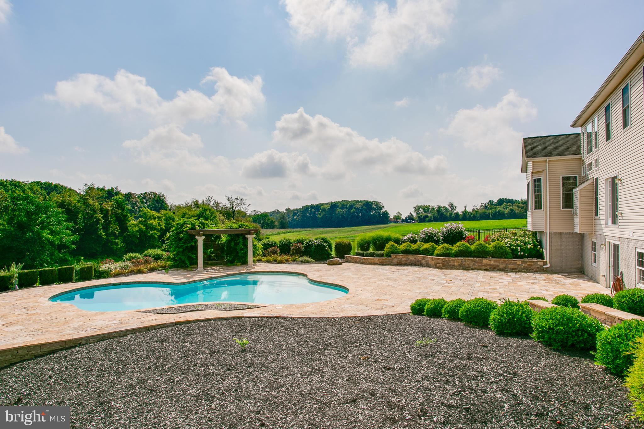 4628 Dave Rill Road Hampstead, MD 21074 - Photo 27 of 30 a view of swimming pool with a yard and large trees