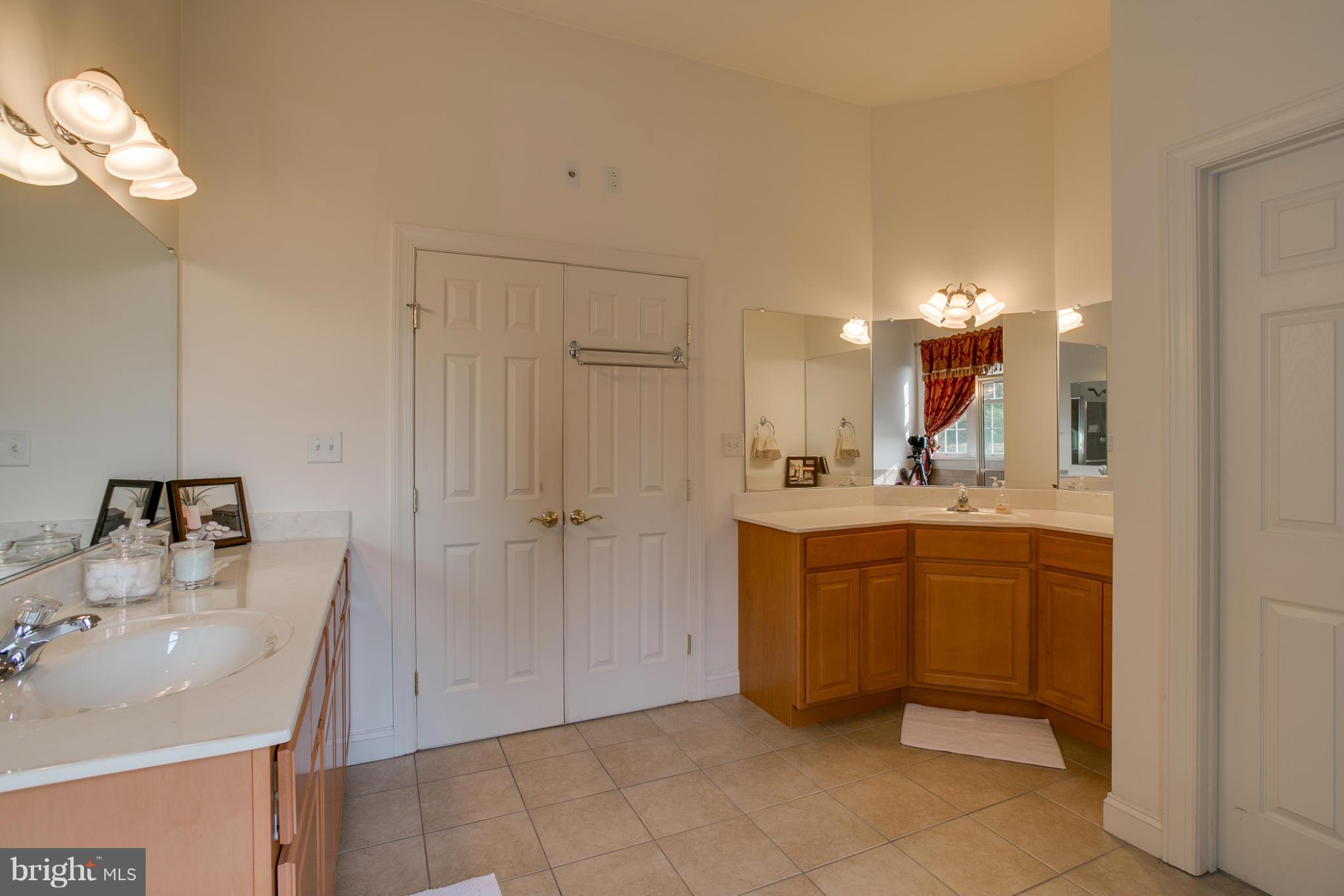 4628 Dave Rill Road Hampstead, MD 21074 - Photo 9 of 30 a bathroom with a sink vanity and mirror