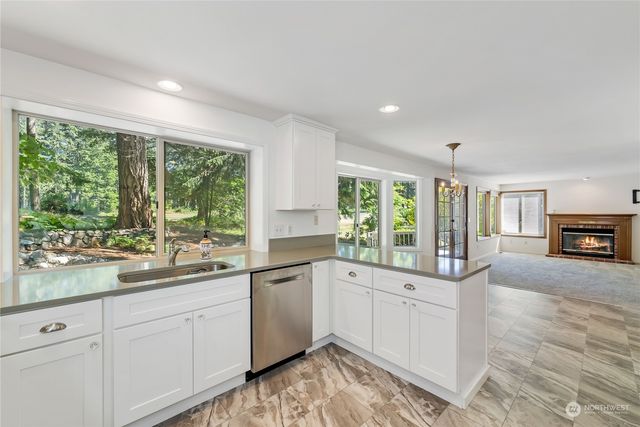 a kitchen with a sink and large window