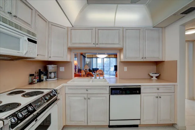 a kitchen with cabinets and appliances