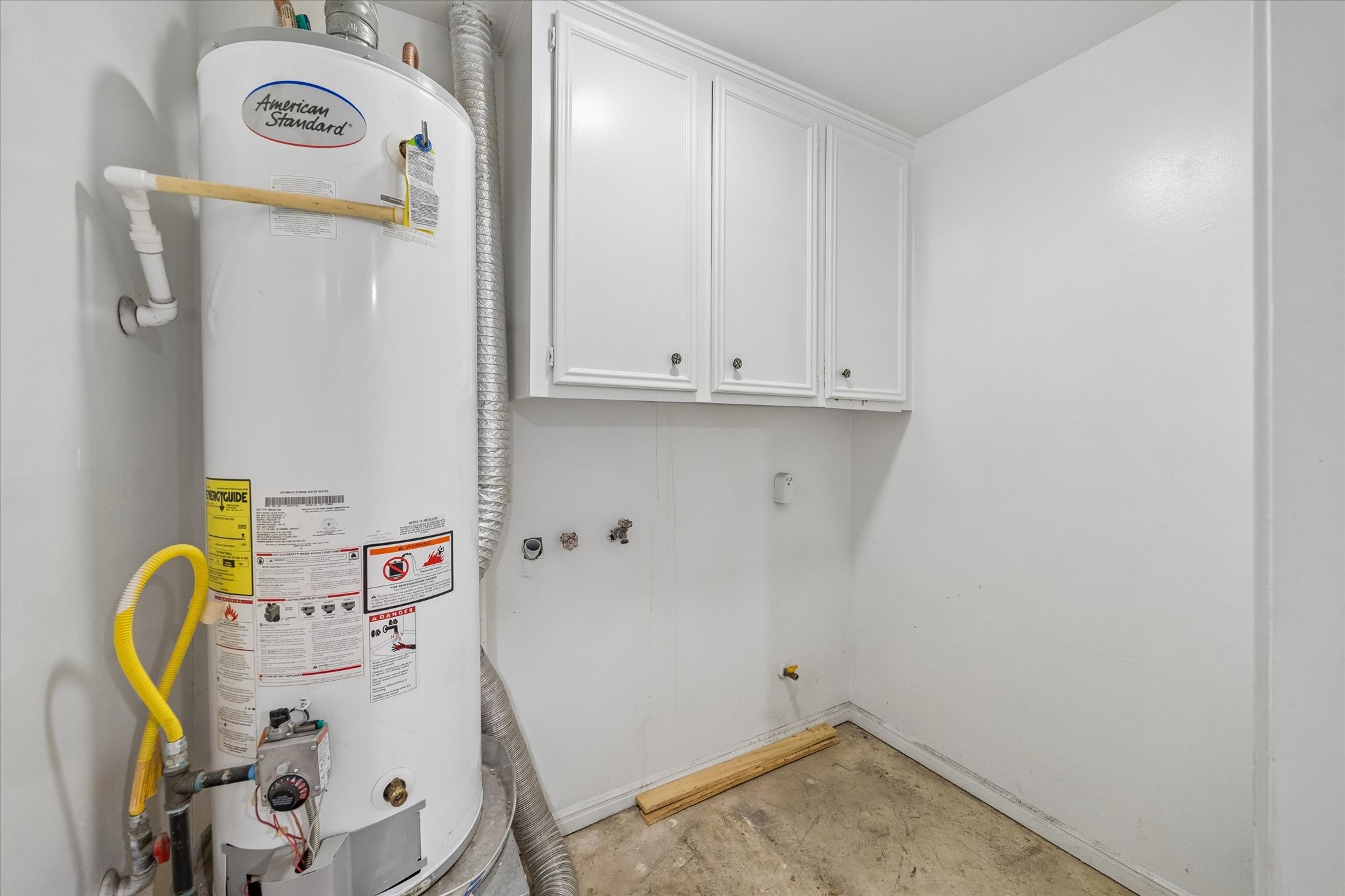 25114 Spring Ridge Drive Spring, TX 77386 - Photo 22 of 24 a view of storage and utility room with washer and dryer