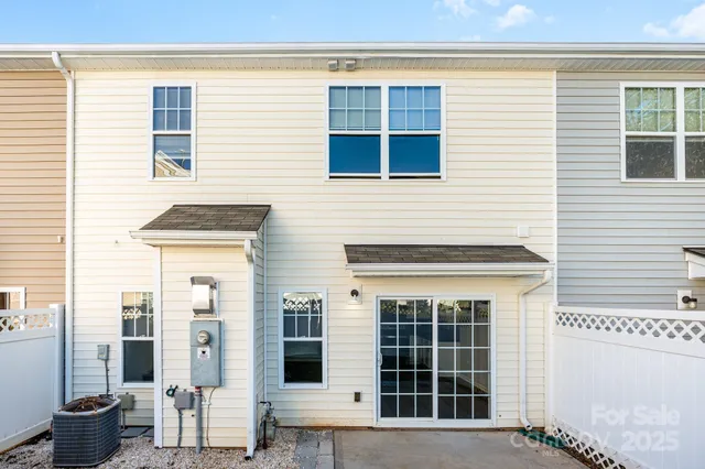 a view of a house with a potted plant and a window