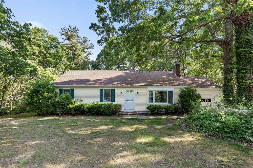 34 Diandy Road Bourne, MA 02562 - Photo 1 of 20 a front view of a house with a garden