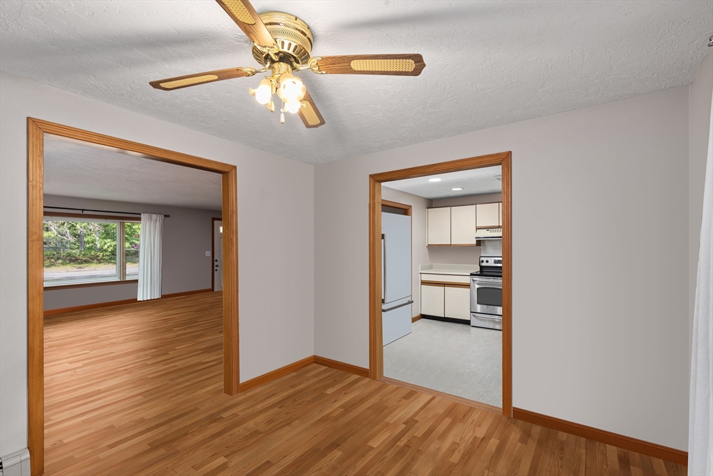 34 Diandy Road Bourne, MA 02562 - Photo 11 of 20 a view of a room with wooden floor a ceiling fan and windows