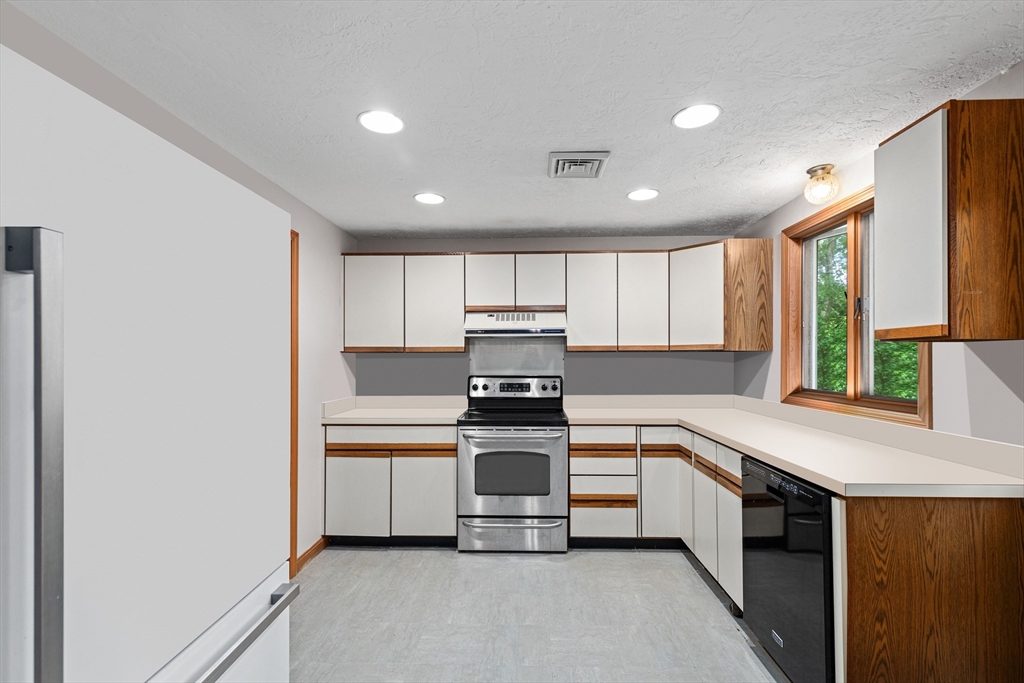 34 Diandy Road Bourne, MA 02562 - Photo 12 of 20 a kitchen with kitchen island granite countertop a stove and a sink