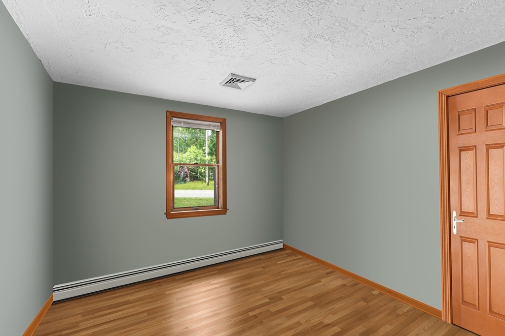 34 Diandy Road Bourne, MA 02562 - Photo 14 of 20 a view of an empty room with wooden floor and a window