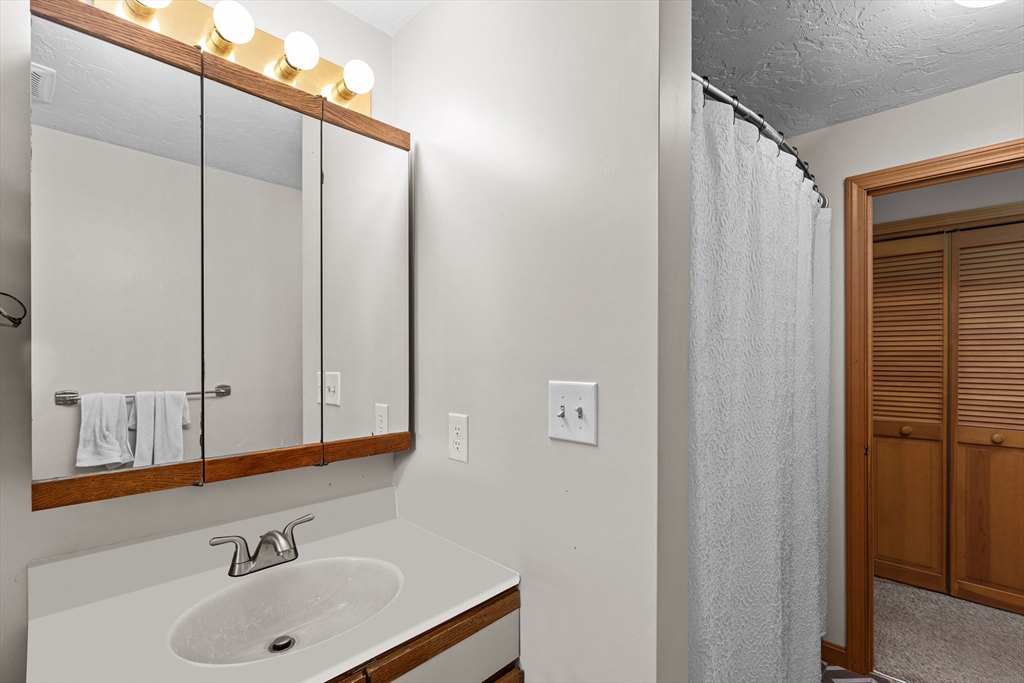 34 Diandy Road Bourne, MA 02562 - Photo 15 of 20 a bathroom with a sink and a mirror