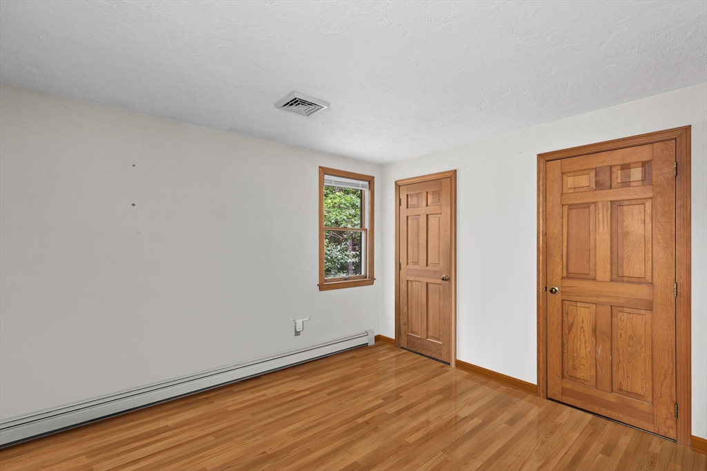 34 Diandy Road Bourne, MA 02562 - Photo 16 of 20 an empty room with wooden floor and windows
