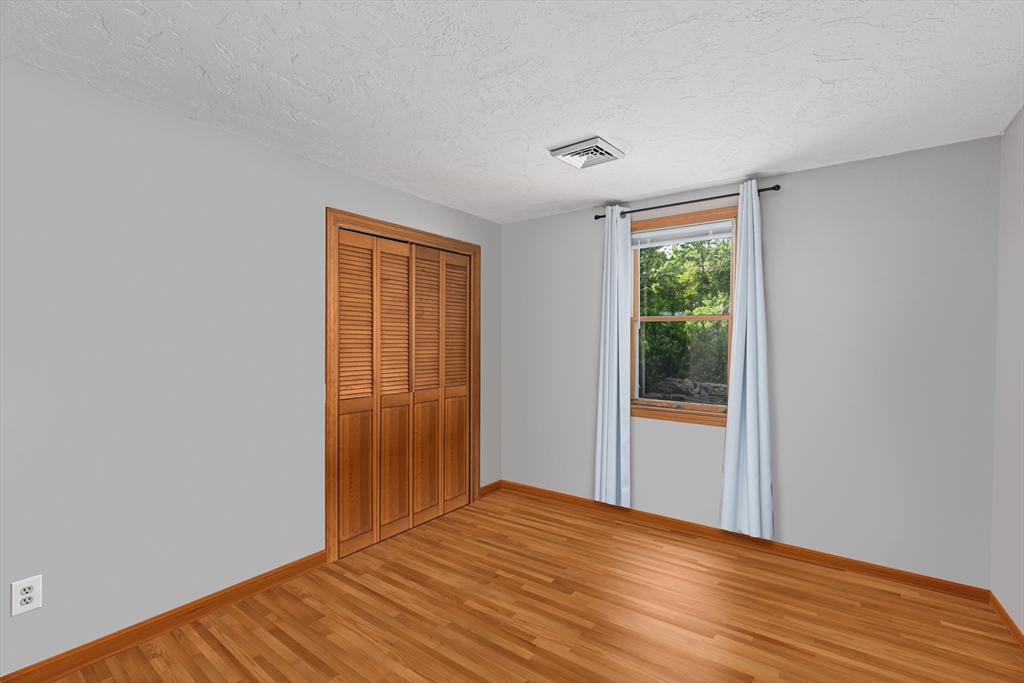 34 Diandy Road Bourne, MA 02562 - Photo 19 of 20 a view of empty room with wooden floor and fan