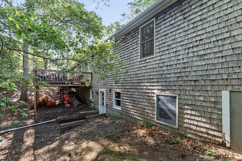 34 Diandy Road Bourne, MA 02562 - Photo 6 of 20 a backyard of a house with lots of green space