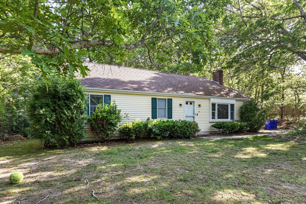 34 Diandy Road Bourne, MA 02562 - Photo 7 of 20 a view of a house with a yard and potted plants