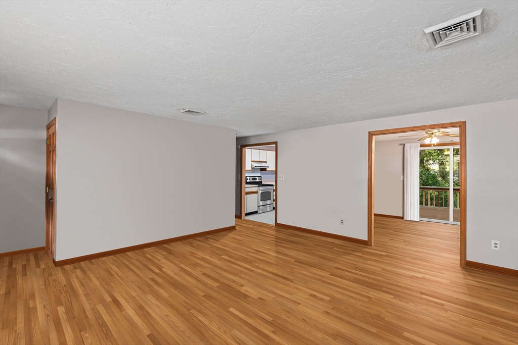 34 Diandy Road Bourne, MA 02562 - Photo 9 of 20 a view of an empty room with wooden floor and a window