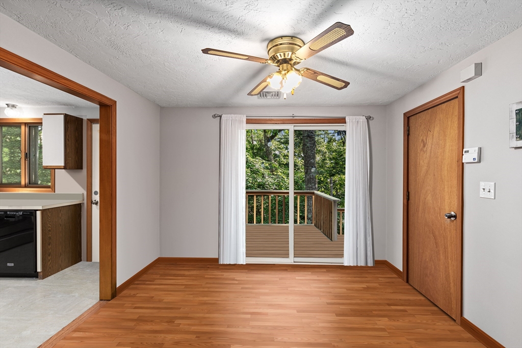34 Diandy Road Bourne, MA 02562 - Photo 10 of 20 a view of an empty room with a chandelier fan and a window