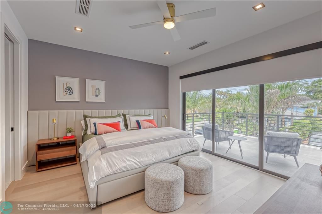 2929 Center Avenue Fort Lauderdale, FL 33308 - Photo 11 of 35 a bedroom with a large bed and a balcony