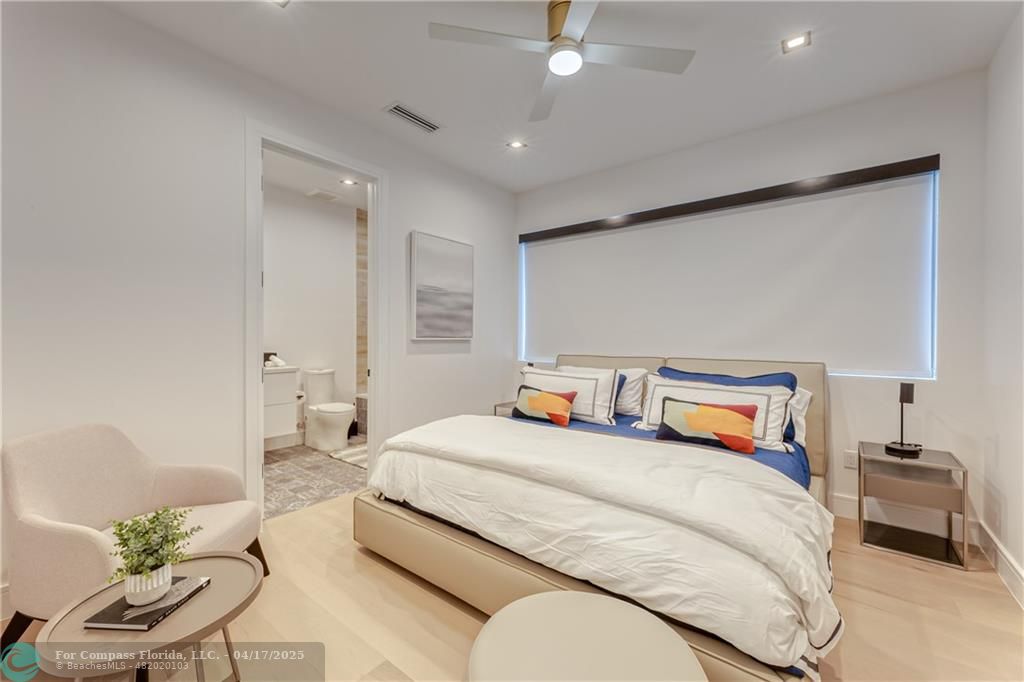 2929 Center Avenue Fort Lauderdale, FL 33308 - Photo 12 of 35 a bedroom with a bed and a chair