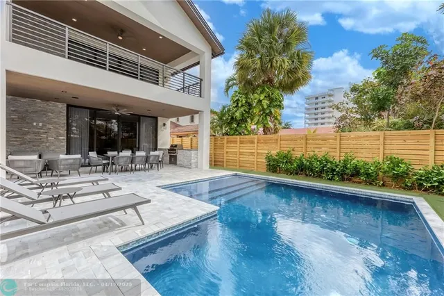 a view of a house with sitting area and garden