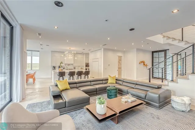 a living room with furniture and a table