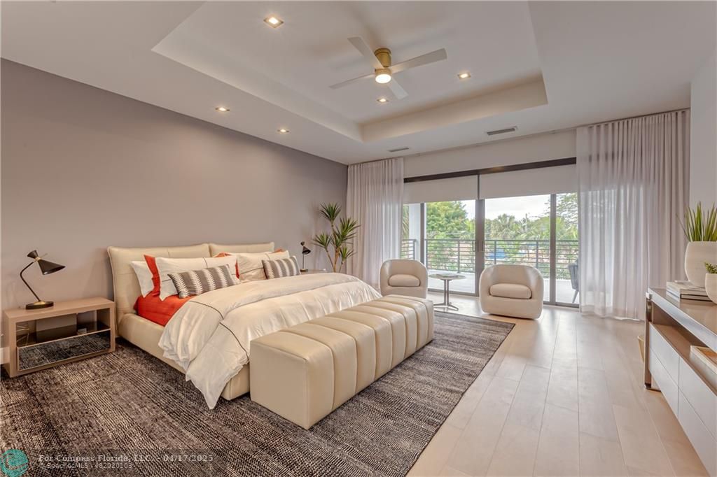 2929 Center Avenue Fort Lauderdale, FL 33308 - Photo 8 of 35 a bedroom with bed and large windows