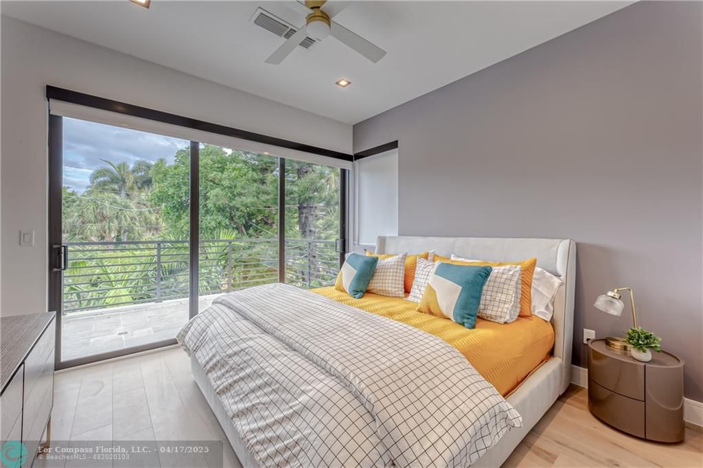 2929 Center Avenue Fort Lauderdale, FL 33308 - Photo 10 of 35 a bedroom with a large bed and a large window