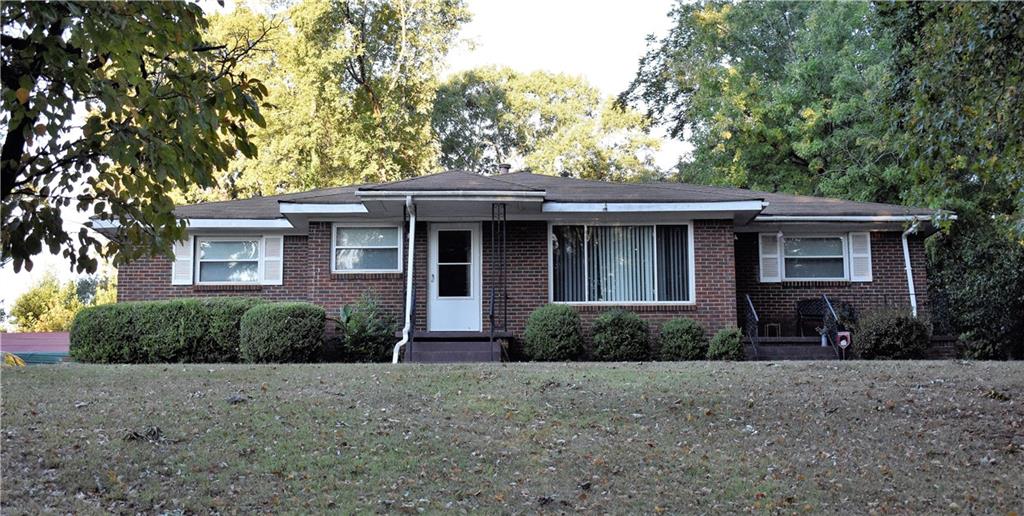 2033 Nettie Court Decatur, GA 30032 - Photo 1 of 1 a front view of a house with a garden