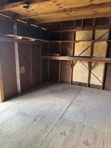 a view of an empty room with racks on the wall