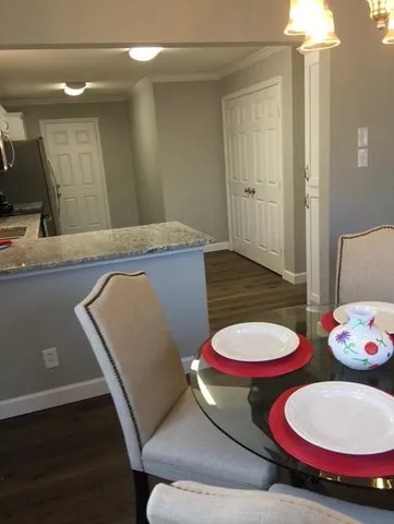 a bathroom with a toilet and a mirror