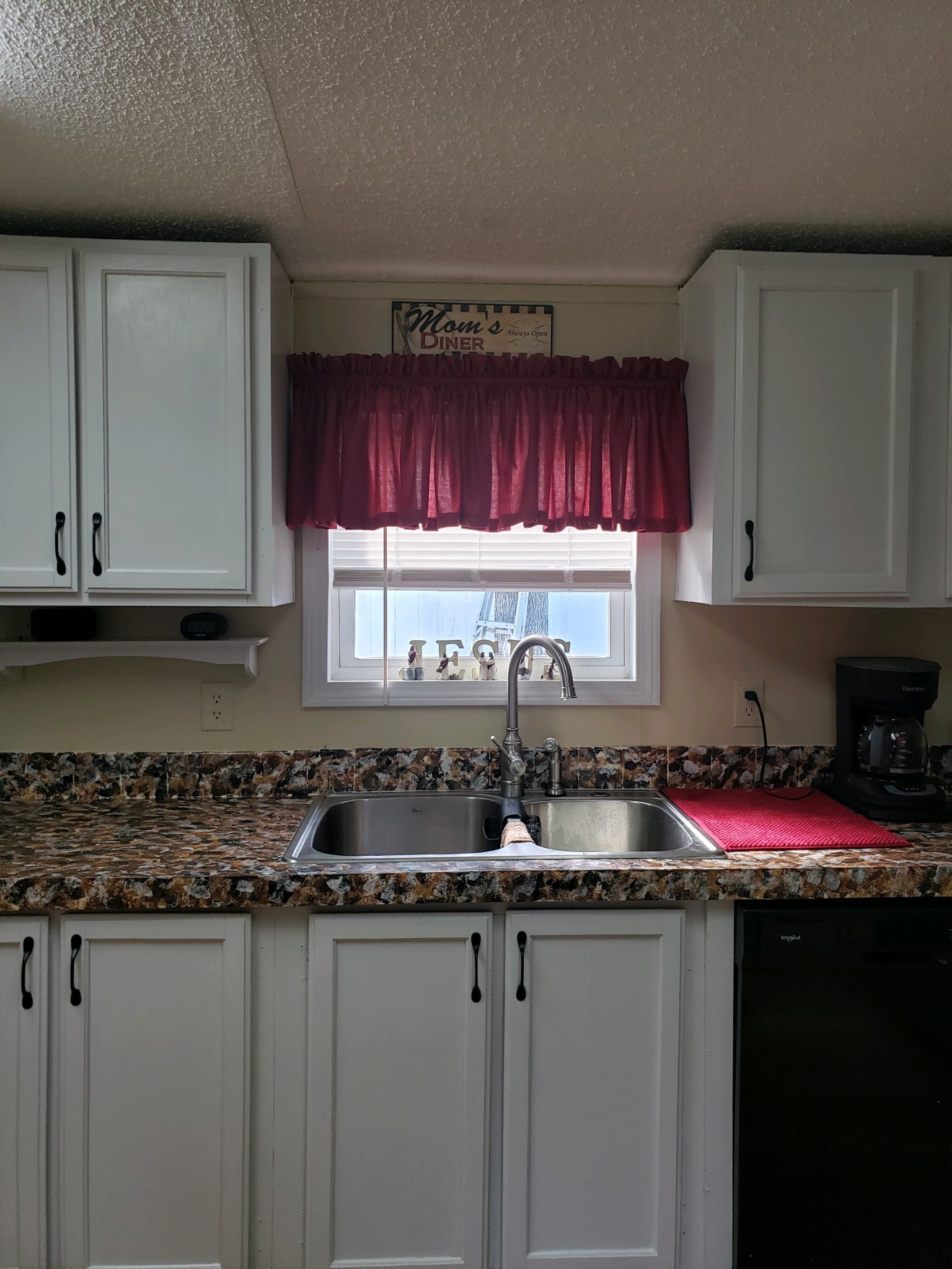 1354 Holloway Road Lebanon, TN 37090 - Photo 7 of 9 a kitchen with granite countertop a sink a stove a microwave cabinets and a window