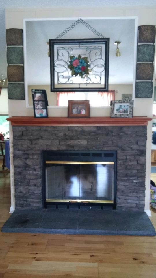 1354 Holloway Road Lebanon, TN 37090 - Photo 8 of 9 a fireplace with stainless steel appliances and cabinets