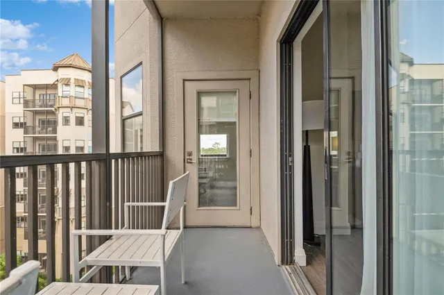 a view of a balcony with furniture