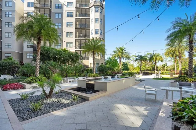 a front view of a multi story building with yard