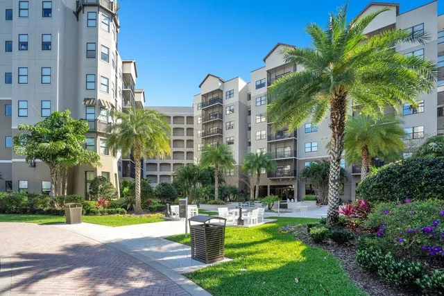 a view of a house with a backyard and a tub
