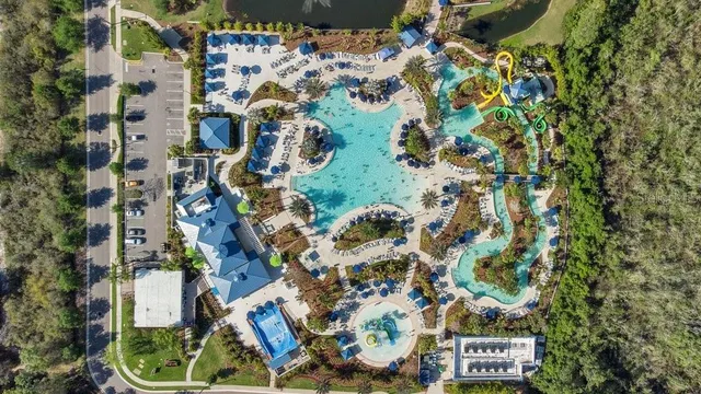 a view of a lake in middle of the green field