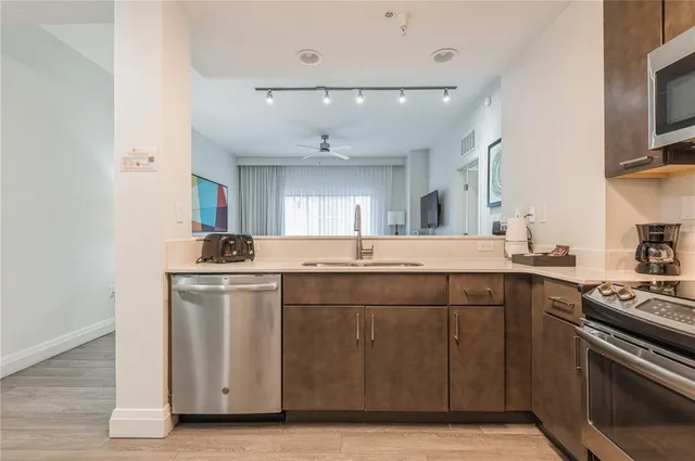 a kitchen with a sink and cabinets