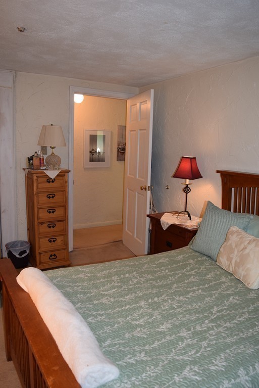 140 Swanson Road, Unit 413 Boxborough, MA 01719 - Photo 15 of 26 a bedroom with a bed and a closet